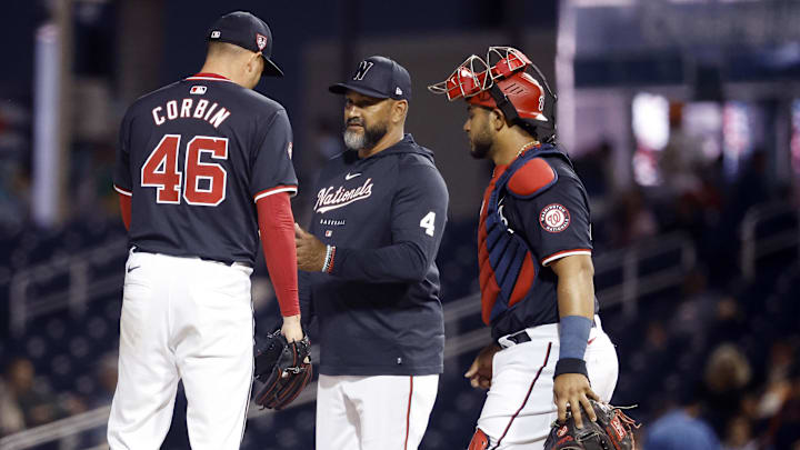 Feb 24, 2024; West Palm Beach, Florida, USA; Washington Nationals manager Dave Martinez (4) and Keibert Ruiz