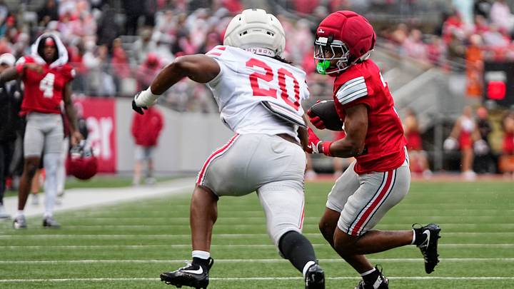 Wide receiver Devin McCuin (3) runs around linebacker Cincere Johnson (20) during the Ohio State football spring game at Ohio Stadium in Columbus on April 18, 2026. Wide receiver Devin McCuin (3) runs around linebacker Cincere Johnson (20) during the Ohio State football spring game at Ohio Stadium in Columbus on April 18, 2026.