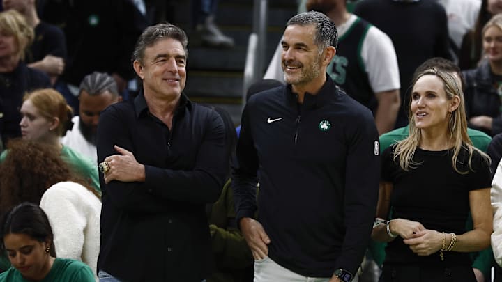 Apr 4, 2025; Boston, Massachusetts, USA; Bill Chisholm, center, who leads a group that is buying the Boston Celtics, stands with current owner Wyc Grousbeck and Chisholm’s wife, Kimberly Chisholm before the game between the Boston Celtics and the Phoenix Suns at TD Garden. Mandatory Credit: Winslow Townson-Imagn Images