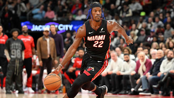 Dec 1, 2024; Toronto, Ontario, CAN;  Miami Heat forward Jimmy Butler (22) dribbles the ball against the Toronto Raptors in the first half at Scotiabank Arena. Mandatory Credit: Dan Hamilton-Imagn Images