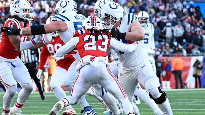 Dec 1, 2024; Foxborough, Massachusetts, USA; Indianapolis Colts offensive tackle Bernhard Raimann (79) blocks New England Patriots safety Kyle Dugger (23) during the first half at Gillette Stadium. Mandatory Credit: Eric Canha-Imagn Images