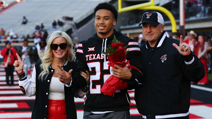 Nov 30, 2024; Lubbock, Texas, USA;  Texas Tech Red Raiders defensive back Devynn Cromwell (22) is honored on senior day before the game against the West Virginia Mountaineers at Jones AT&T Stadium and Cody Campbell Field. Mandatory Credit: Michael C. Johnson-Imagn Images