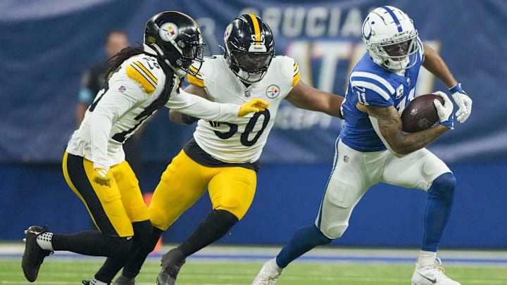 Pittsburgh Steelers linebacker Elandon Roberts (50) and Pittsburgh Steelers cornerback Donte Jackson (26) chase after Indianapolis Colts wide receiver Michael Pittman Jr. (11) on Sunday, Sept. 29, 2024, during a game against the Pittsburgh Steelers at Lucas Oil Stadium in Indianapolis.