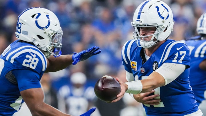 Oct 5, 2025; Indianapolis, Indiana, USA; Indianapolis Colts quarterback Daniel Jones (17) hands off the ball to Indianapolis Colts running back Jonathan Taylor (28) during a game against the Las Vegas Raiders at Lucas Oil Stadium. Mandatory Credit: Grace Smith-USA TODAY Network via Imagn Images