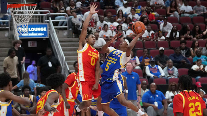 West guard Jason Crowe Jr. (5) shoots the ball as East guard Deron Rippey Jr. defends during the McDonald's All-American boys high school basketball game featuring all of the top seniors in the country at Desert Diamond Arena in Glendale, on March 31, 2026.