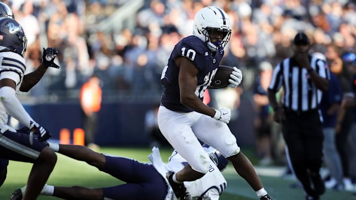 Penn State Nittany Lions running back Nicholas Singleton (10) avoids a tackle while running with the ball against the Nevada Wolf Pack at Beaver Stadium. Penn State Nittany Lions running back Nicholas Singleton (10) avoids a tackle while running with the ball against the Nevada Wolf Pack at Beaver Stadium.