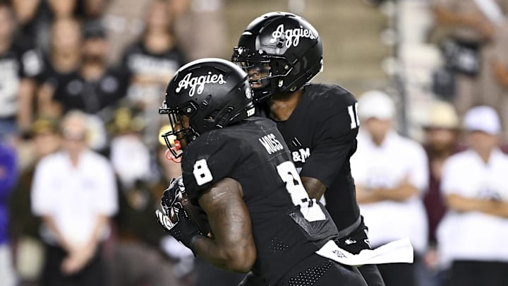 Texas A&M Aggies quarterback Marcel Reed (10) hands off the ball to running back Le'Veon Moss (8) during the fourth quarter against the LSU Tigers. The Aggies defeated the Tigers 38-23; at Kyle Field. 