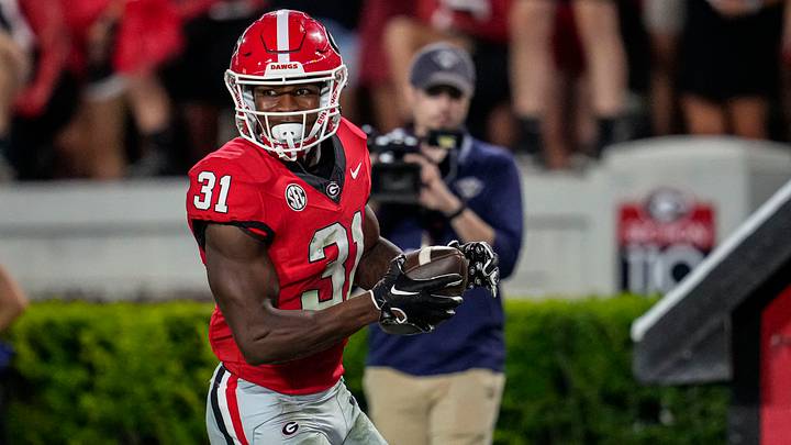 Sep 2, 2023; Athens, Georgia, USA; Georgia Bulldogs defensive player Kyron Jones (31) returns an interception for a touchdown against the Tennessee Martin Skyhawks during the second half at Sanford Stadium. Mandatory Credit: Dale Zanine-USA TODAY Sports Sep 2, 2023; Athens, Georgia, USA; Georgia Bulldogs defensive player Kyron Jones (31) returns an interception for a touchdown against the Tennessee Martin Skyhawks during the second half at Sanford Stadium. Mandatory Credit: Dale Zanine-USA TODAY Sports