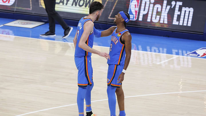 Apr 22, 2025; Oklahoma City, Oklahoma, USA; Oklahoma City Thunder guard Shai Gilgeous-Alexander (2) and forward Chet Holmgren (7) laugh in the fourth quarter during game two of first round for the 2024 NBA Playoffs against the Memphis Grizzlies at Paycom Center. Mandatory Credit: Alonzo Adams-Imagn Images