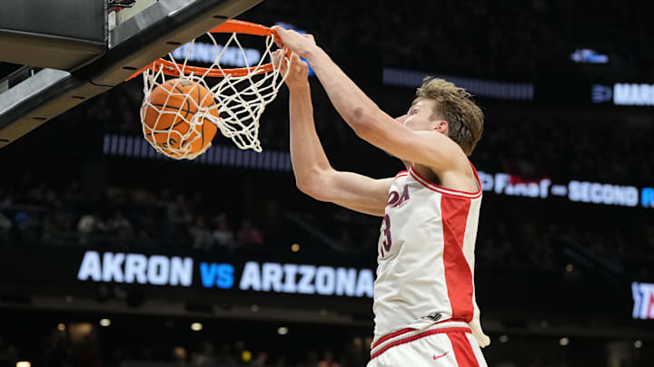 Arizona forward Henri Veesaar (13) dunks the ball against the Akron Zips during the Wildcats' first-round NCAA Tournament game at Climate Pledge Arena in Seattle. Arizona forward Henri Veesaar (13) dunks the ball against the Akron Zips during the Wildcats' first-round NCAA Tournament game at Climate Pledge Arena in Seattle.