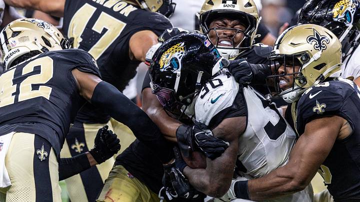 Aug 15, 2026; New Orleans, Louisiana, USA;  Jacksonville Jaguars running back J'mari Taylor (30) is tackled by New Orleans Saints cornerback Mike Reid (42) during the second half at Caesars Superdome. Mandatory Credit: Stephen Lew-Imagn Images