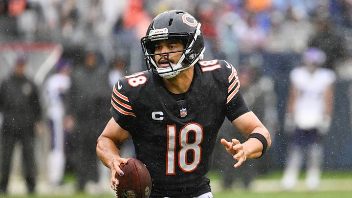 Chicago Bears quarterback Caleb Williams (18) scrambles