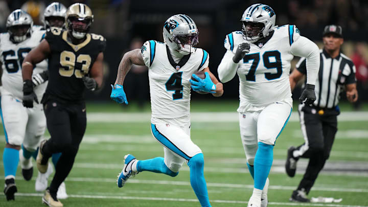 Dec 14, 2025; New Orleans, Louisiana, USA; Carolina Panthers wide receiver Tetairoa McMillan (4) runs the ball during the second quarter against the New Orleans Saints at Caesars Superdome. Mandatory Credit: Matthew Hinton-Imagn Images Dec 14, 2025; New Orleans, Louisiana, USA; Carolina Panthers wide receiver Tetairoa McMillan (4) runs the ball during the second quarter against the New Orleans Saints at Caesars Superdome. Mandatory Credit: Matthew Hinton-Imagn Images