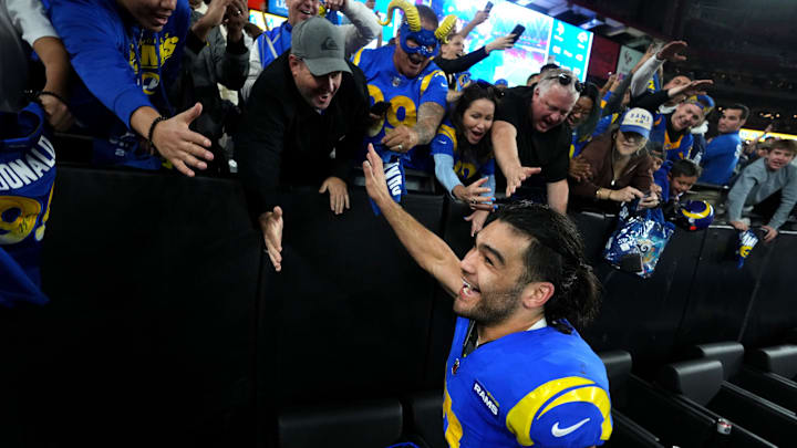 Los Angeles Rams receiver Puka Nacua (17) high-fives fans after their 27-9 playoff win over the Minnesota Vikings at State Farm Stadium on Jan. 13, 2025, in Glendale.