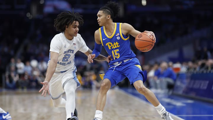 Mar 15, 2024; Washington, D.C., USA; Pittsburgh Panthers guard Jaland Lowe (15) dribbles the ball as North Carolina Tar Heels guard Elliot Cadeau (2) defends in the first half at Capital One Arena. Mandatory Credit: Geoff Burke-Imagn Images