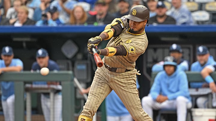 May 31, 2024; Kansas City, Missouri, USA;  San Diego Padres first baseman Luis Arraez (4) singles in the first inning against the Kansas City Royals at Kauffman Stadium. Mandatory Credit: Peter Aiken-USA TODAY Sports