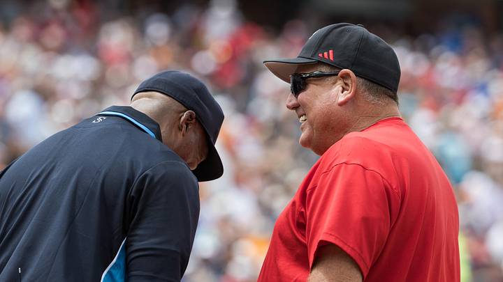 May 30, 2026; Oklahoma City, OK, USA;  Texas Tech Red Raiders head coach Gerry Glasco talks to home plate umpire in the third inning against the Tennessee Lady Volunteers during the NCAA Women’s College World Series at Devon Park. Mandatory Credit: Brett Rojo-Imagn Images
