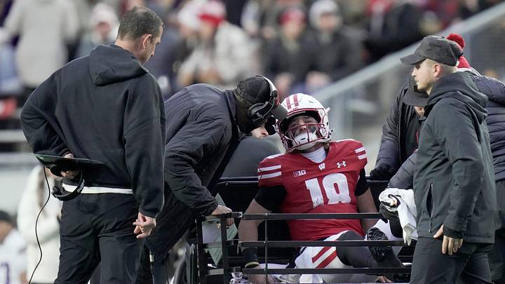 Wisconsin quarterback Danny O'Neil (18) is carted off the field after being injured during the first quarter of their game against Washington. Wisconsin quarterback Danny O'Neil (18) is carted off the field after being injured during the first quarter of their game against Washington.