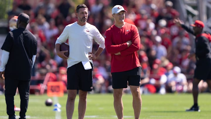 Jul 27, 2022; Santa Clara, CA, USA; San Francisco 49ers head coach Kyle Shanahan (left) and general manager John Lynch watches the players during Training Camp at the SAP Performance Facility near Levi Stadium. Mandatory Credit: Stan Szeto-Imagn Images Jul 27, 2022; Santa Clara, CA, USA; San Francisco 49ers head coach Kyle Shanahan (left) and general manager John Lynch watches the players during Training Camp at the SAP Performance Facility near Levi Stadium. Mandatory Credit: Stan Szeto-Imagn Images