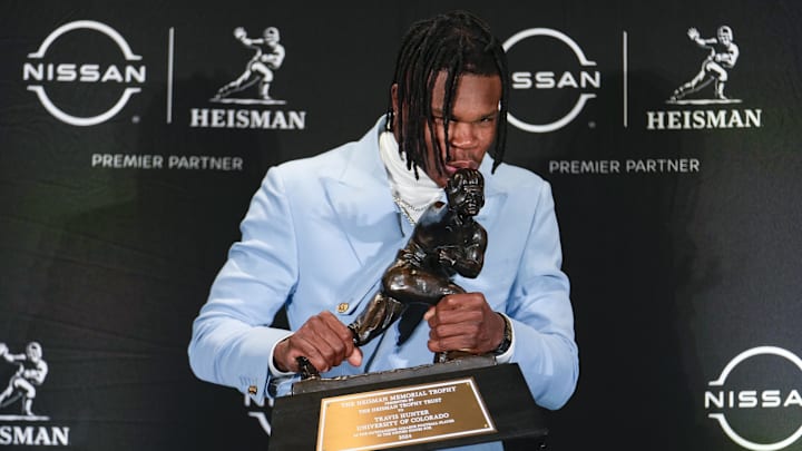 Dec 14, 2024; New York, NY, USA; Colorado Buffaloes wide receiver/cornerback Travis Hunter poses for a photo after winning the Heisman Trophy award during the 2024 Heisman Trophy Presentation. Mandatory Credit: Lucas Boland-Imagn Images