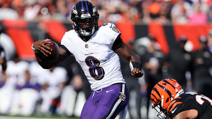 Baltimore Ravens quarterback Lamar Jackson (8) escapes the tackle of Cincinnati Bengals safety Geno Stone (22) during the second half at Paycor Stadium. Baltimore Ravens quarterback Lamar Jackson (8) escapes the tackle of Cincinnati Bengals safety Geno Stone (22) during the second half at Paycor Stadium.