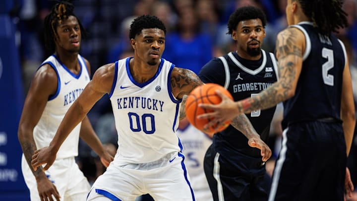 Oct 30, 2025; Lexington, KY, USA; Kentucky Wildcats guard Otega Oweh (00) defends against Georgetown Hoyas guard Malik Mack (2) during the second half at Rupp Arena at Central Bank Center. Mandatory Credit: Jordan Prather-Imagn Images Oct 30, 2025; Lexington, KY, USA; Kentucky Wildcats guard Otega Oweh (00) defends against Georgetown Hoyas guard Malik Mack (2) during the second half at Rupp Arena at Central Bank Center. Mandatory Credit: Jordan Prather-Imagn Images