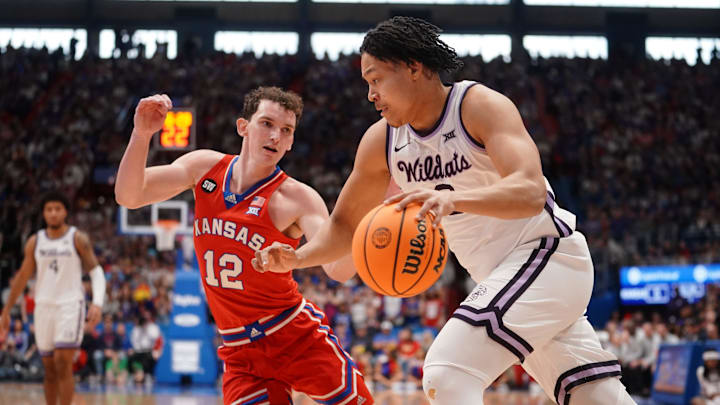 Kansas State Exavier Wilson drives against Kansas guard Wilder Evers during the Sunflower Showdown game inside Allen Fieldhouse in Lawrence.