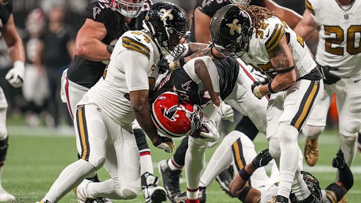 New Orleans Saints defensive end Cameron Jordan (94) and safety Tyrann Mathieu (32) make a tackle against the Atlanta Falcons 