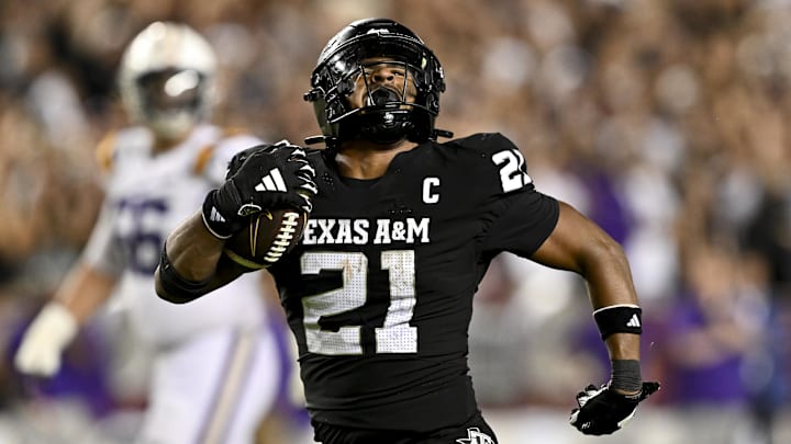 Oct 26, 2024; College Station, Texas, USA; Texas A&M Aggies linebacker Taurean York (21) reacts after catching the ball for an interception in the fourth quarter against the LSU Tigers at Kyle Field. Mandatory Credit: Maria Lysaker-Imagn Images. 