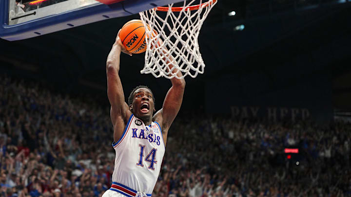 Feb 9, 2026; Lawrence, Kansas, USA; Kansas Jayhawks guard Melvin Council Jr. (14) dunks the ball after defeating the Arizona Wildcats at Allen Fieldhouse. Mandatory Credit: Jay Biggerstaff-Imagn Images