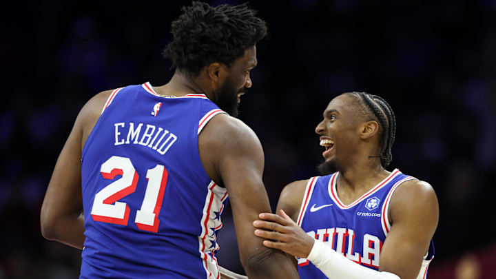 Jan 27, 2026; Philadelphia, Pennsylvania, USA; Philadelphia 76ers center Joel Embiid (21) celebrates with guard Tyrese Maxey (0) after their alley oop dunk connection against the Milwaukee Bucks during the second quarter at Xfinity Mobile Arena. Mandatory Credit: Bill Streicher-Imagn Images