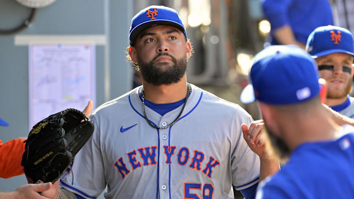 Oct 14, 2024; Los Angeles, California, USA; New York Mets pitcher Sean Manaea (59) greets teammates in the dugout after being relieved in the sixth inning against the Los Angeles Dodgers during game two of the NLCS for the 2024 MLB Playoffs at Dodger Stadium. Mandatory Credit: Jayne Kamin-Oncea-Imagn Images Oct 14, 2024; Los Angeles, California, USA; New York Mets pitcher Sean Manaea (59) greets teammates in the dugout after being relieved in the sixth inning against the Los Angeles Dodgers during game two of the NLCS for the 2024 MLB Playoffs at Dodger Stadium. Mandatory Credit: Jayne Kamin-Oncea-Imagn Images