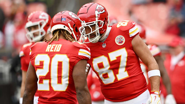Dec 15, 2024; Cleveland, Ohio, USA; Kansas City Chiefs safety Justin Reid (20) and tight end Travis Kelce (87) greet each other before the game between the Cleveland Browns and the Chiefs at Huntington Bank Field. Mandatory Credit: Ken Blaze-Imagn Images