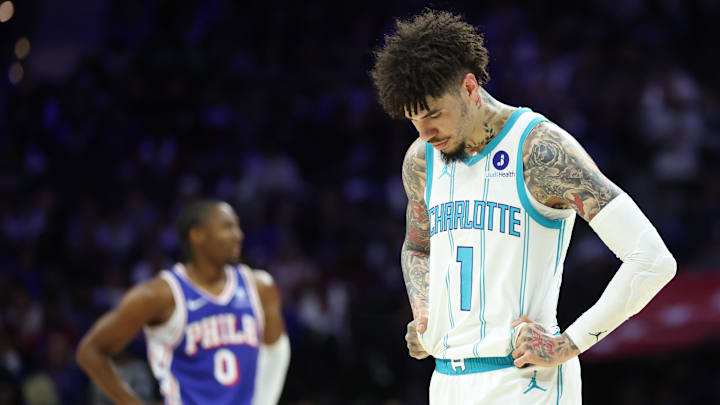 Oct 25, 2025; Philadelphia, Pennsylvania, USA; Charlotte Hornets guard LaMelo Ball (1) looks on in front of Philadelphia 76ers guard Tyrese Maxey (0) during the first quarter at Xfinity Mobile Arena. Mandatory Credit: Bill Streicher-Imagn Images