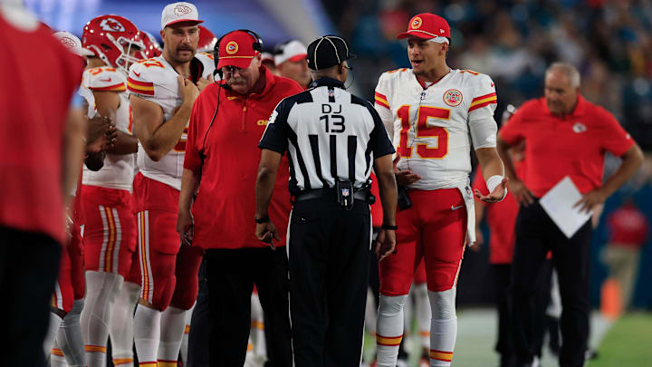 Kansas City Chiefs quarterback Patrick Mahomes (15) talks with down judge Patrick Turner (13) as head coach Andy Reid and tight end Travis Kelce (87) are on the sideline during the second quarter of a preseason NFL football game Saturday, Aug. 10, 2024 at EverBank Stadium in Jacksonville, Fla. [Corey Perrine/Florida Times-Union]