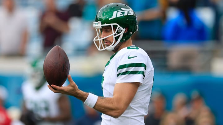 New York Jets quarterback Aaron Rodgers (8) balances a ball before an NFL football matchup Sunday, Dec. 15, 2024 at EverBank Stadium in Jacksonville, Fla. [Corey Perrine/Florida Times-Union]