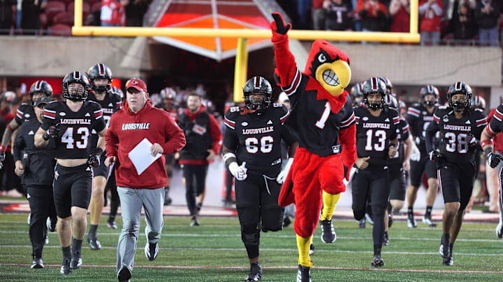 Louisville comes out onto the field before the game against Boston College Saturday night at L&N Stadium
