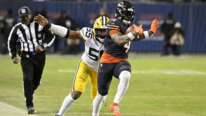 D'Andre Swift attempts to elude Kingsley Enagbare of Green Bay during the second half of last week's Bears playoff win.