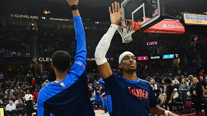 Jan 8, 2025; Cleveland, Ohio, USA; Oklahoma City Thunder guard Shai Gilgeous-Alexander, right, is introduced before the game between the Cleveland Cavaliers and the Thunder at Rocket Mortgage FieldHouse. Mandatory Credit: Ken Blaze-Imagn Images Jan 8, 2025; Cleveland, Ohio, USA; Oklahoma City Thunder guard Shai Gilgeous-Alexander, right, is introduced before the game between the Cleveland Cavaliers and the Thunder at Rocket Mortgage FieldHouse. Mandatory Credit: Ken Blaze-Imagn Images