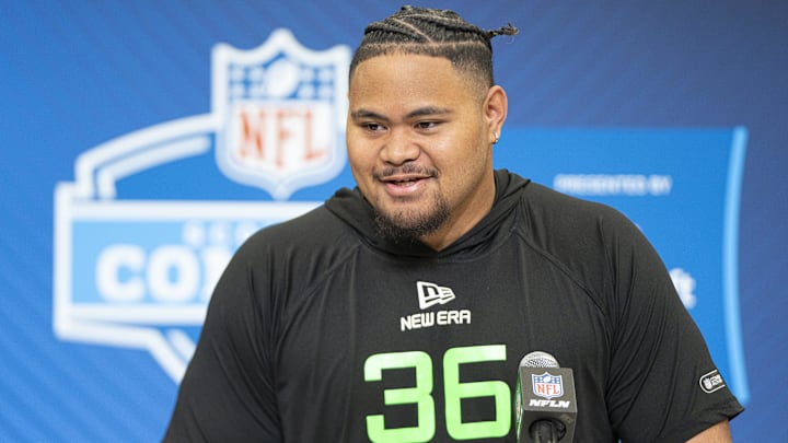 University of Arizona offensive lineman Jonah Savaiinaea (OL36) answers questions at a press conference during the 2025 NFL Combine at Indiana Convention Center. University of Arizona offensive lineman Jonah Savaiinaea (OL36) answers questions at a press conference during the 2025 NFL Combine at Indiana Convention Center.