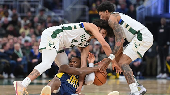 Dec 13, 2023; Milwaukee, Wisconsin, USA; Indiana Pacers center Bennedict Mathurin (00) battles for a loose ball against Milwaukee Bucks guard Andre Jackson Jr. (44) and guard MarJon Beauchamp (3) in the first quarter at Fiserv Forum. Mandatory Credit: Benny Sieu-Imagn Images Dec 13, 2023; Milwaukee, Wisconsin, USA; Indiana Pacers center Bennedict Mathurin (00) battles for a loose ball against Milwaukee Bucks guard Andre Jackson Jr. (44) and guard MarJon Beauchamp (3) in the first quarter at Fiserv Forum. Mandatory Credit: Benny Sieu-Imagn Images