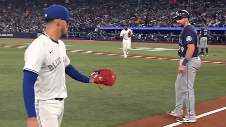 Berrios and Raleigh exchange words during the game. 