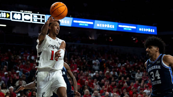Cincinnati Bearcats forward Baba Miller (18) passes as BYU Cougars center Abdullah Ahmed (34) guards him in the second half of the NCAA Basketball game at Fifth Third Arena in Cincinnati on Tuesday, March 3, 2026.