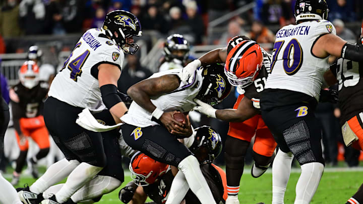 Nov 16, 2025; Cleveland, Ohio, USA; Baltimore Ravens quarterback Lamar Jackson (8) is sacked by Cleveland Browns defensive tackle Mike Hall Jr. (51) during the fourth quarter at Huntington Bank Field. Mandatory Credit: Ken Blaze-Imagn Images