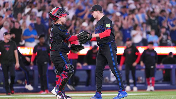 Aug 14, 2026; Toronto, Ontario, CAN; Toronto Blue Jays catcher Alejandro Kirk (30) celebrates the win with relief pitcher Louis Varland (77) against the New York Yankees at the end of the ninth inning at Rogers Centre. Mandatory Credit: Nick Turchiaro-Imagn Images Aug 14, 2026; Toronto, Ontario, CAN; Toronto Blue Jays catcher Alejandro Kirk (30) celebrates the win with relief pitcher Louis Varland (77) against the New York Yankees at the end of the ninth inning at Rogers Centre. Mandatory Credit: Nick Turchiaro-Imagn Images