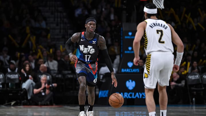 Apr 3, 2024; Brooklyn, New York, USA; Brooklyn Nets guard Dennis Schroder (17) brings the ball up court while being defended by Indiana Pacers guard Andrew Nembhard (2) during the third quarter at Barclays Center. Mandatory Credit: John Jones-Imagn Images