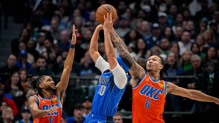 Dec 2, 2023; Dallas, Texas, USA; Dallas Mavericks guard Seth Curry (30) attempts to shoot over Oklahoma City Thunder guard Isaiah Joe (11) and forward Jaylin Williams (6) during the second quarter at the American Airlines Center. Mandatory Credit: Jerome Miron-USA TODAY Sports