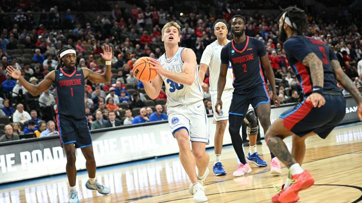 Mar 21, 2024; Omaha, NE, USA; Brigham Young Cougars guard Dallin Hall (30) drives against Duquesne Dukes guard Dae Dae Grant (3) in the second half during the first round of the NCAA Tournament at CHI Health Center Omaha. Mandatory Credit: Steven Branscombe-USA TODAY Sports Mar 21, 2024; Omaha, NE, USA; Brigham Young Cougars guard Dallin Hall (30) drives against Duquesne Dukes guard Dae Dae Grant (3) in the second half during the first round of the NCAA Tournament at CHI Health Center Omaha. Mandatory Credit: Steven Branscombe-USA TODAY Sports