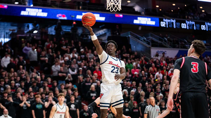 Ballard’s Jude Gibson (23) shoots a layup against ADM in the 3A state championship game on March 13, 2026, at Casey’s Center in Des Moines.