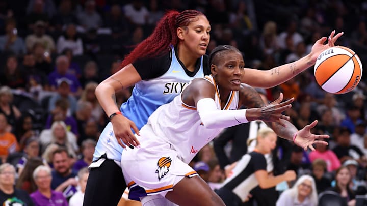 Aug 28, 2025; Phoenix, Arizona, USA; Phoenix Mercury forward Natasha Mack (4) against Chicago Sky center Kamilla Cardoso (10) in the first half at Phx Arena. Mandatory Credit: Mark J. Rebilas-Imagn Images